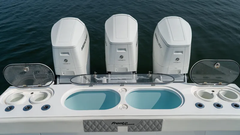 Slide: The Image of 2023 Front Runner 47 Center Console with four powerful outboard engines. - 49