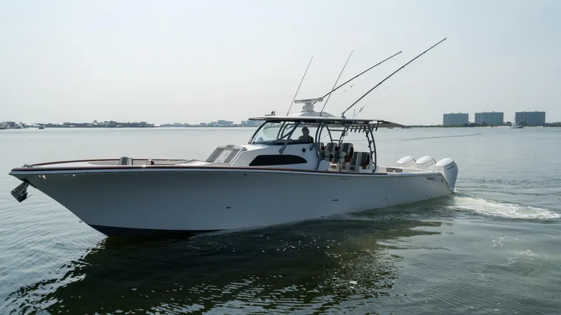 Slide: The Image of 2023 Front Runner 47 Center Console boat cruising on calm water. - 5