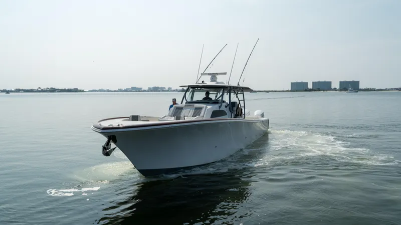 Slide: The Image of 2023 Front Runner 47 Center Console boat cruising on calm water. - 8