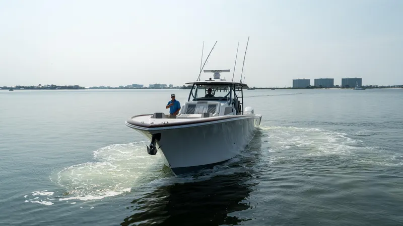 Slide: The Image of 2023 Front Runner 47 Center Console boat cruising on calm water. - 9