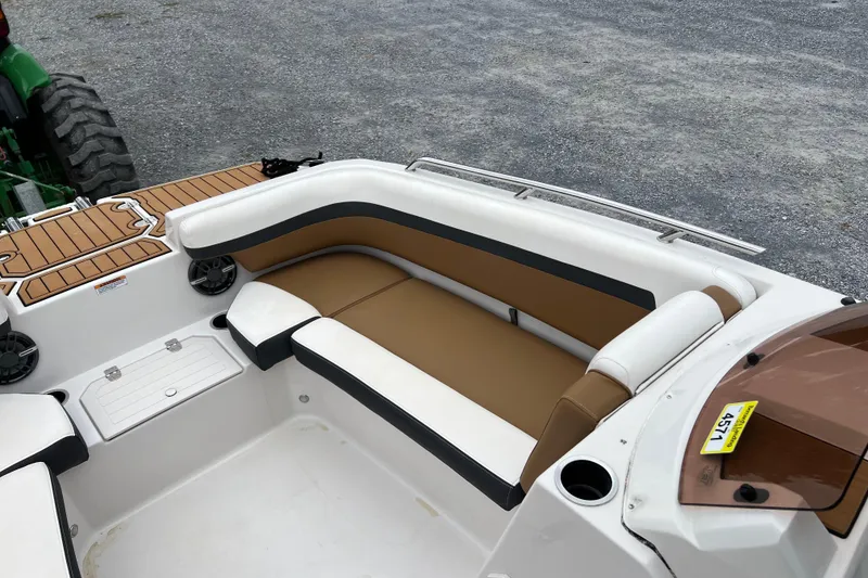 Slide: The Image of 2024 Starcraft SVX 211 OB boat interior with tan and white seating. - 17