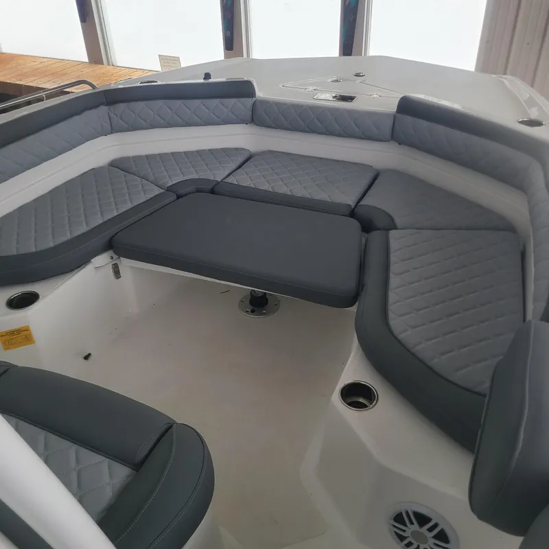 Slide: The Image of 2025 NauticStar 231 Hybrid boat interior with cushioned seating. - 12