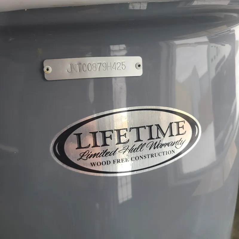 Slide: The Image of 2025 NauticStar 231 Hybrid boat with lifetime hull warranty badge. - 15