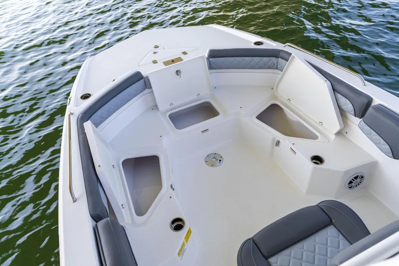 Slide: The Image of 2025 NauticStar 231 Hybrid boat interior with seating and storage compartments. - 23