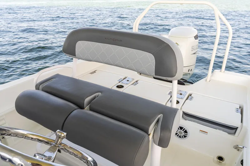 Slide: The Image of 2025 NauticStar 231 Hybrid boat interior with comfortable seating and ocean view. - 26