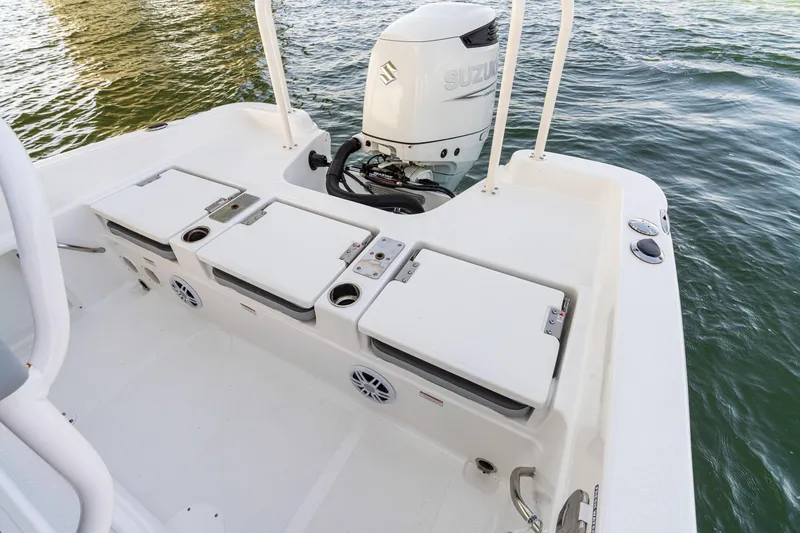 Slide: The Image of 2025 NauticStar 231 Hybrid boat with Suzuki outboard engine on water. - 29