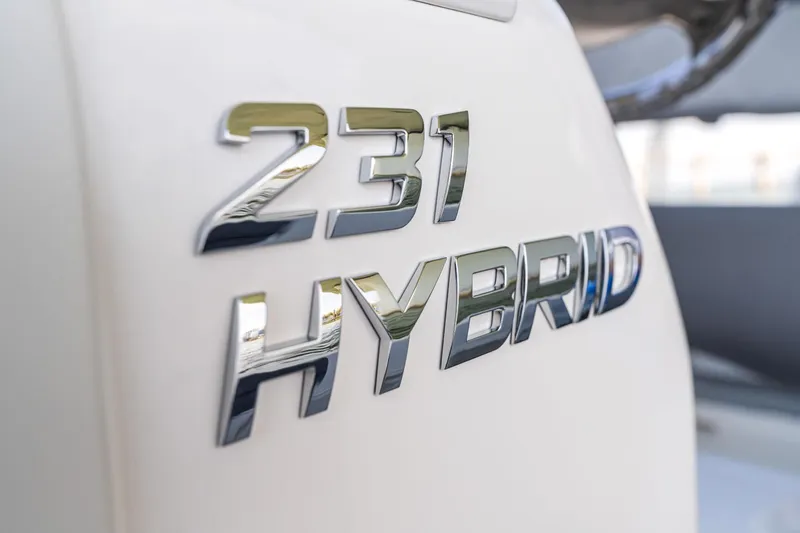 Slide: The Image of Close-up of 2025 NauticStar 231 Hybrid boat emblem. - 4