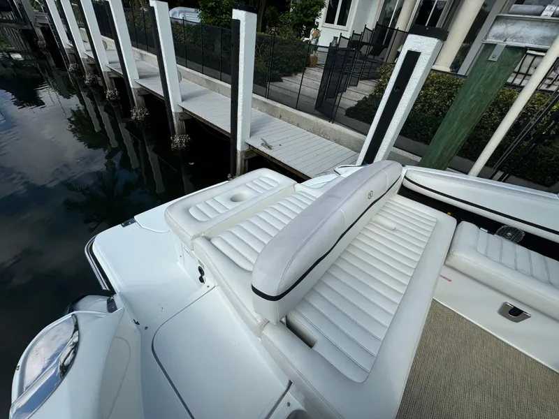 Slide: The Image of 2015 Cobalt R7 boat with white leather seating at a dock. - 14