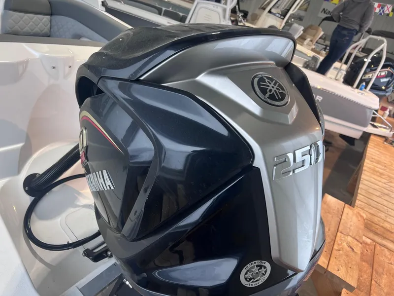 Slide: The Image of 2025 NauticStar 243 DC Deck boat with Yamaha 250 outboard engine. - 5