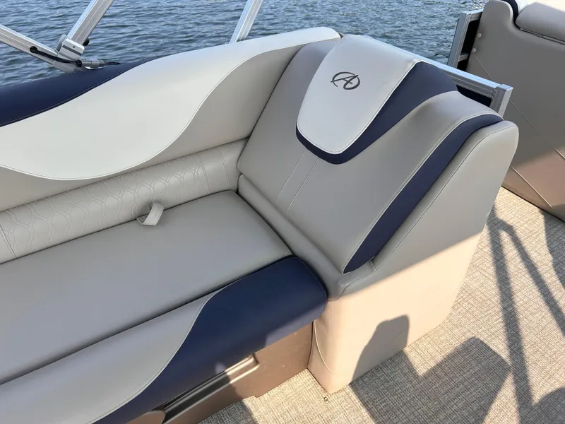 Slide: The Image of 2024 Avalon LSZ Cruise 25' boat seating with elegant gray and navy upholstery. - 15