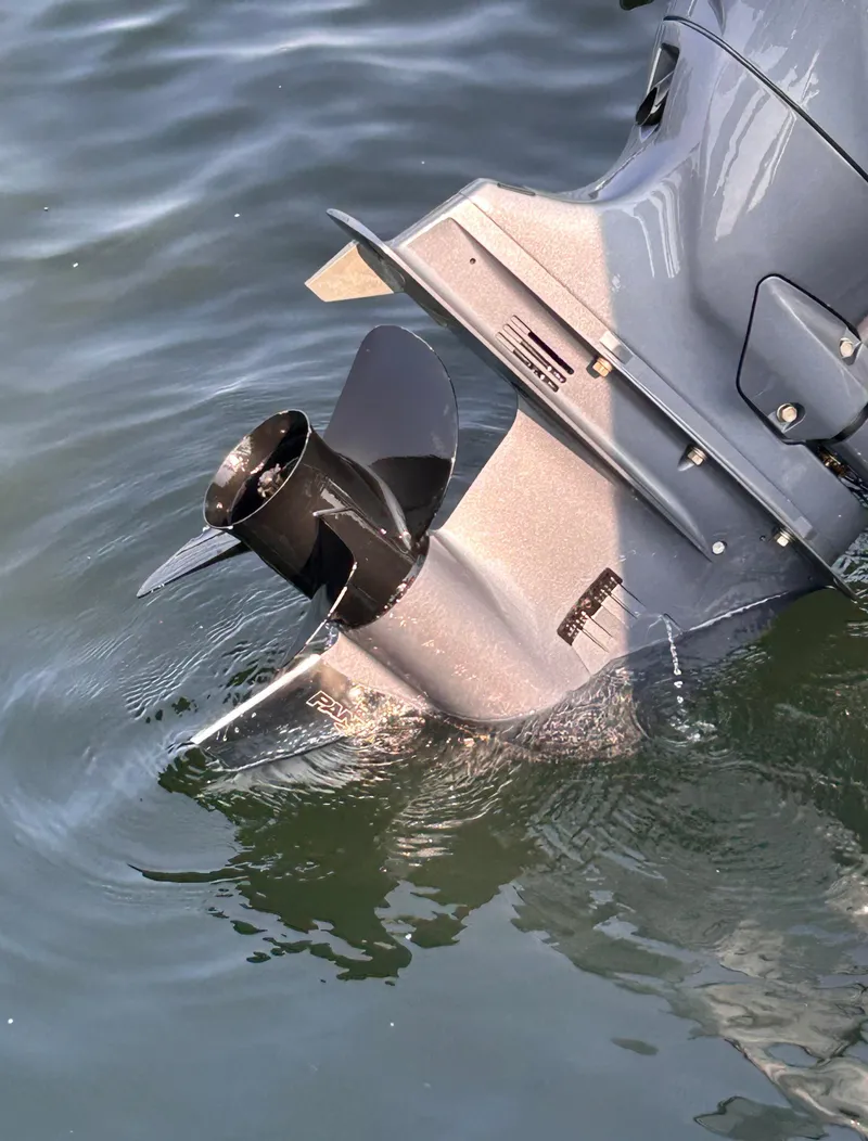 Slide: The Image of 2024 Avalon LSZ Cruise 25' boat motor partially submerged in water. - 29