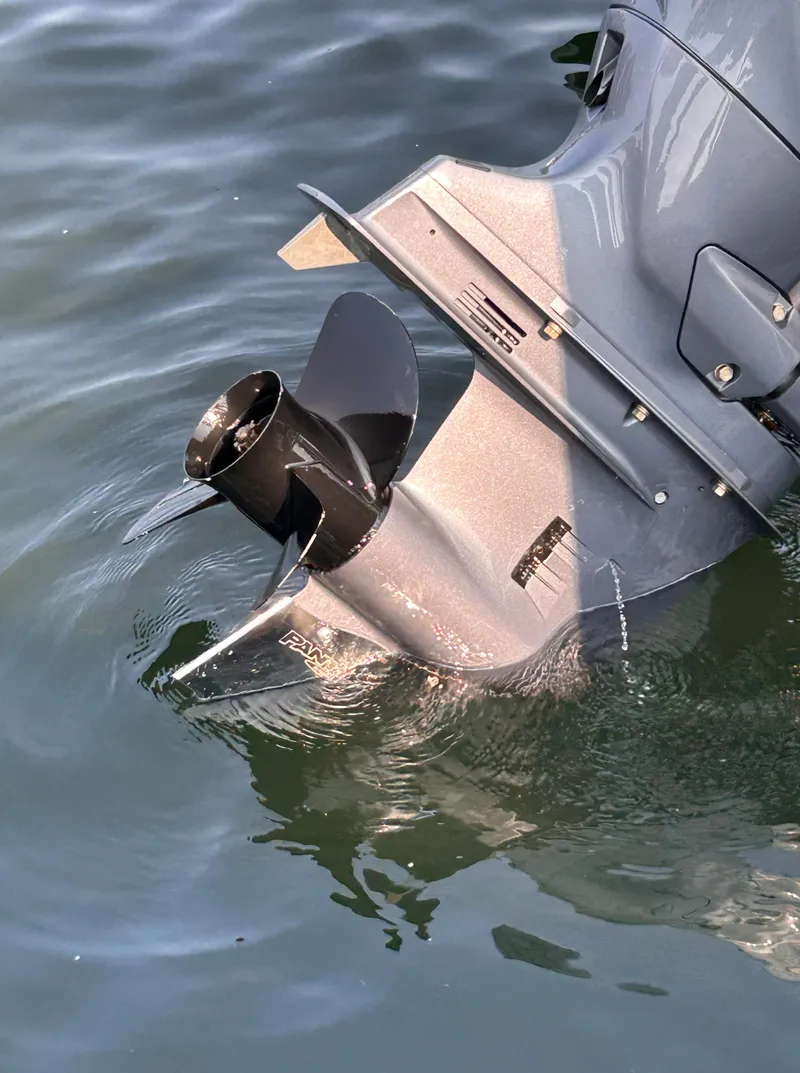 Slide: The Image of 2024 Avalon LSZ Cruise 25' boat motor in water, showcasing propeller design. - 30