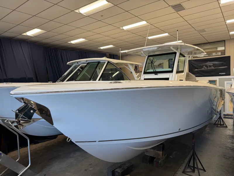 The Image of 2025 Sailfish 312 CC boat displayed indoors, showcasing sleek design and modern features. - 0