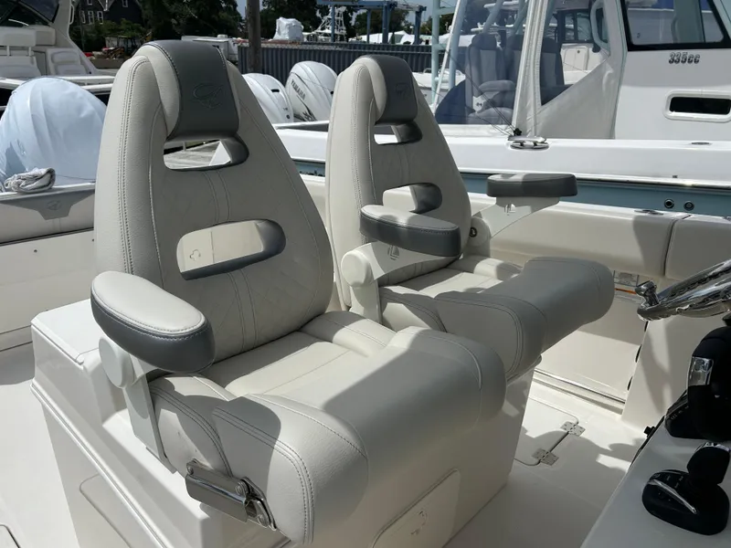 Slide: The Image of Luxury seating on 2025 Sailfish 312 CC boat, featuring plush, ergonomic design. - 17