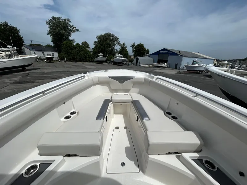 Slide: The Image of 2025 Sailfish 312 CC boat interior with spacious seating and sleek design. - 4