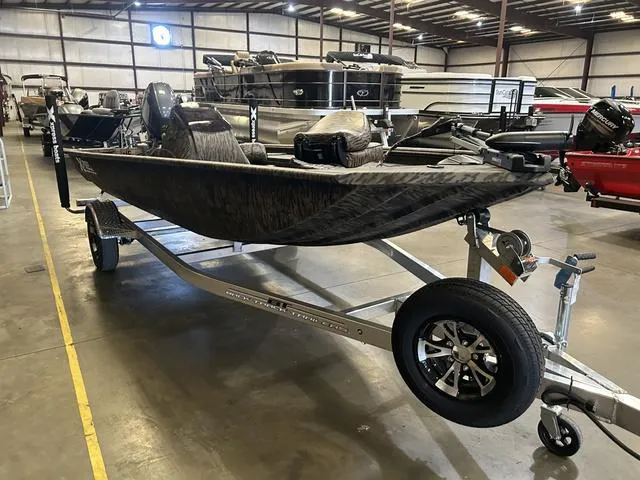 Slide: The Image of 2025 Xpress XP170 boat with Yamaha 70 engine on trailer in showroom. - 3
