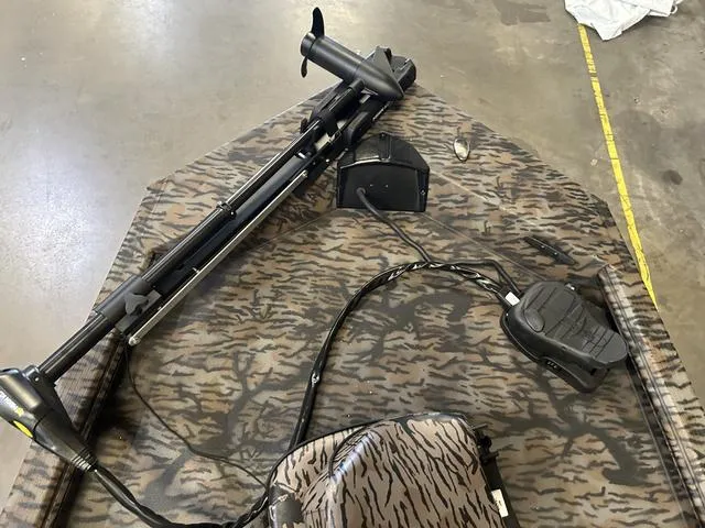 Slide: The Image of 2025 Xpress XP170 boat with Yamaha 70, featuring camo design and trolling motor. - 7