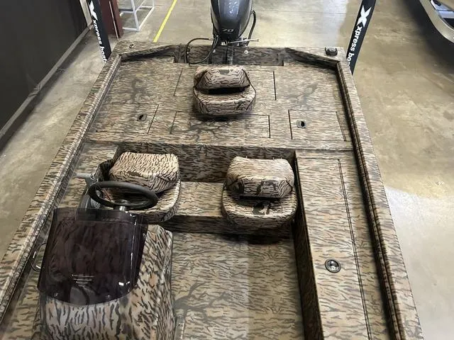 Slide: The Image of 2025 Xpress XP170 boat with Yamaha 70 engine, camo interior design. - 9