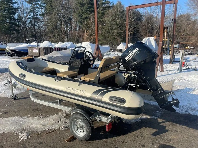 Slide: The Image of 2025 Highfield CL360 GT SE boat with Suzuki 30 outboard motor in snowy setting. - 5