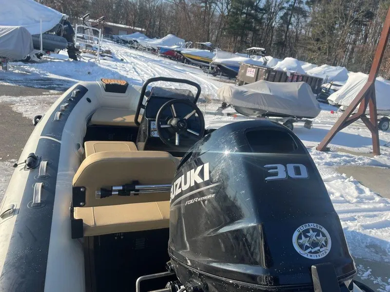 Slide: The Image of 2025 Highfield CL360 GT SE boat interior with beige seating and control panel. - 7