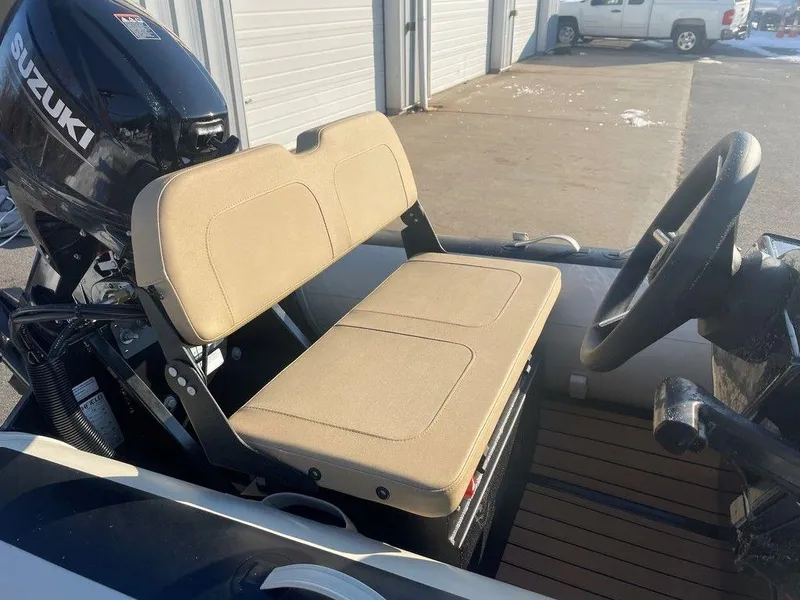 Slide: The Image of Open storage compartment in 2025 Highfield CL360 GT SE boat, showing battery and equipment. - 8