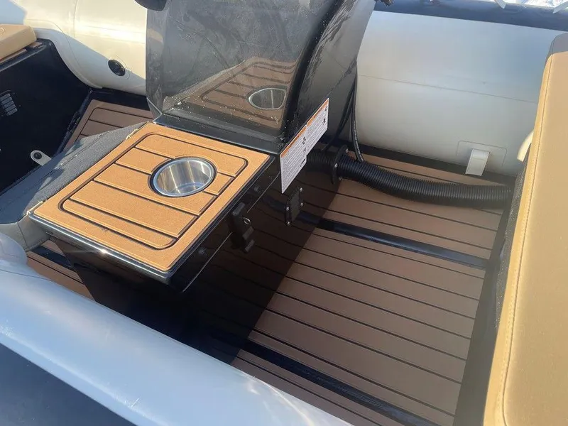 Slide: The Image of 2025 Highfield CL360 GT SE boat with open storage compartment and sunlit deck. - 11