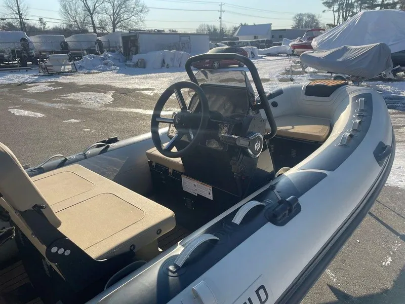 Slide: The Image of 2025 Highfield CL360 GT SE inflatable boat on trailer with Suzuki outboard motor. - 3