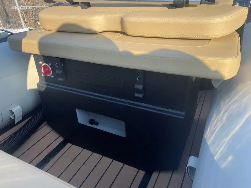 Slide: The Image of 2025 Highfield CL360 GT SE boat interior with wood finish and cup holder. - 9