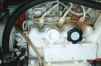 Slide: The Image of Engine of a 1999 Hunter 380 sailboat, showcasing intricate piping and components. - 13