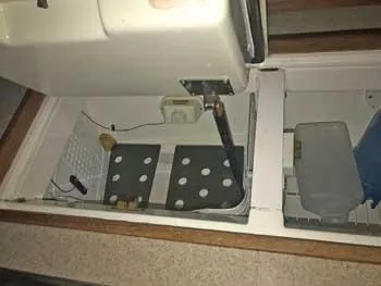 Slide: The Image of Interior view of a 1999 Hunter 380 sailboat, showcasing storage compartments. - 16