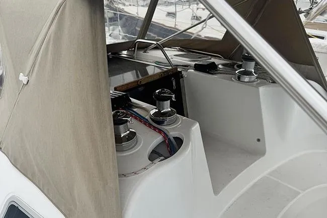 Slide: The Image of 1999 Hunter 380 sailboat cockpit with winches and protective canopy. - 29