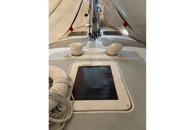 Slide: The Image of Deck view of 1999 Hunter 380 sailboat with ropes and hatch. - 35