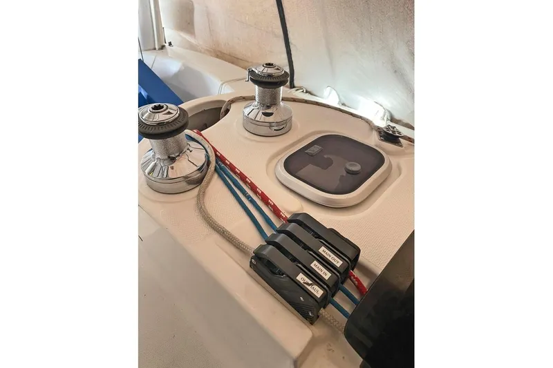 Slide: The Image of Deck of 1999 Hunter 380 sailboat with winches and control lines. - 36