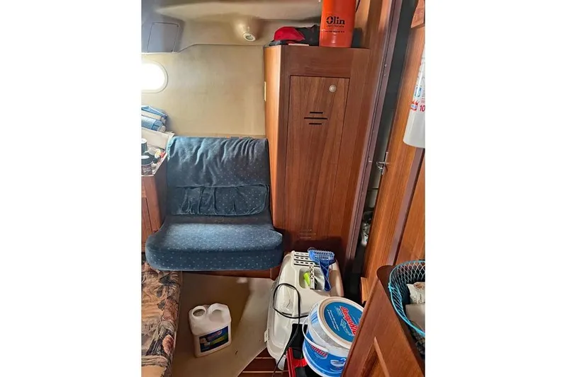 Slide: The Image of Interior of a 1999 Hunter 380 sailboat with seating and storage. - 50