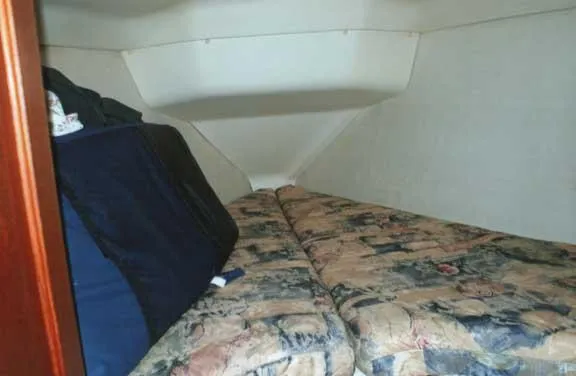 Slide: The Image of Cozy cabin interior of 1999 Hunter 380 sailboat with patterned bedding. - 6