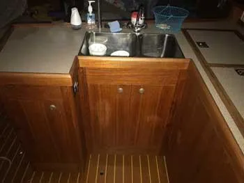 Slide: The Image of Wooden kitchen area with sink on 1999 Hunter 380 sailboat. - 9