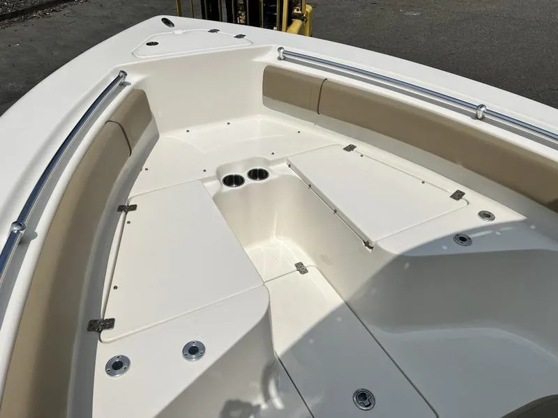 Slide: The Image of 2019 Key West 239FS boat interior with seating and storage compartments. - 10