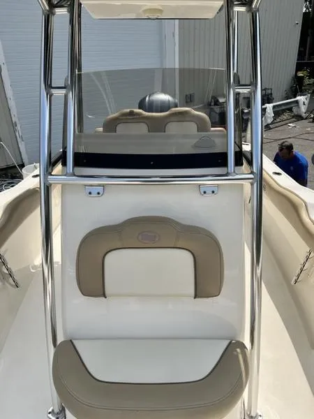 Slide: The Image of 2019 Key West 239FS boat interior with seating and console. - 11