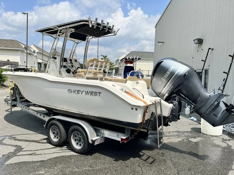 Slide: The Image of 2019 Key West 239FS boat on trailer with Yamaha outboard motor. - 2