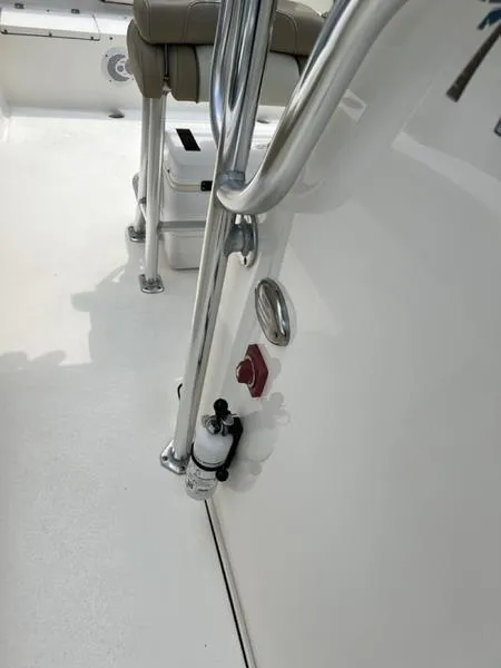 Slide: The Image of 2019 Key West 239FS boat interior with seating and railing details. - 8