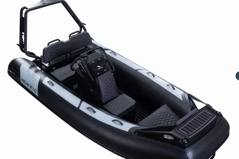 Slide: The Image of 2025 Highfield Sport390 inflatable boat with sleek black design and modern seating. - 5