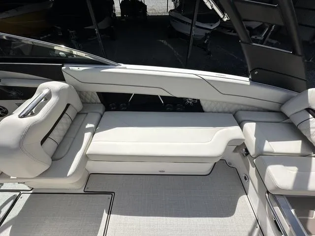 Slide: The Image of Luxurious seating area on 2025 Regal LS6 boat, featuring elegant white upholstery. - 12