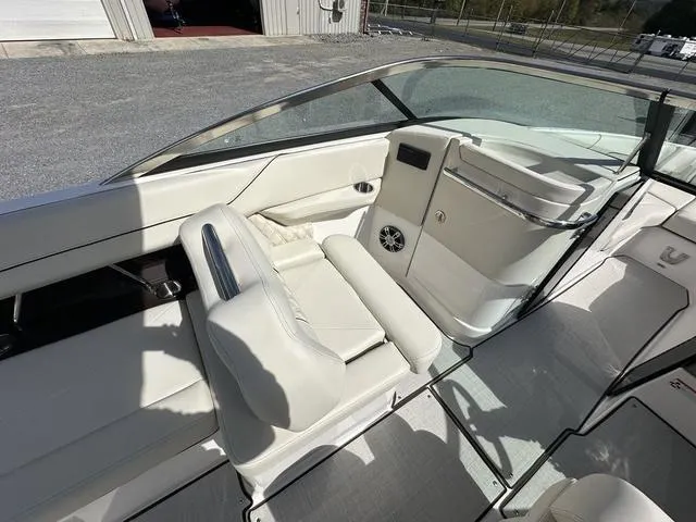 Slide: The Image of 2025 Regal LS6 boat interior with white leather seating and modern design. - 13
