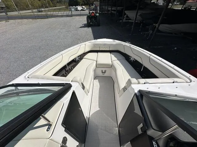 Slide: The Image of 2025 Regal LS6 boat interior with white seating and modern design. - 18