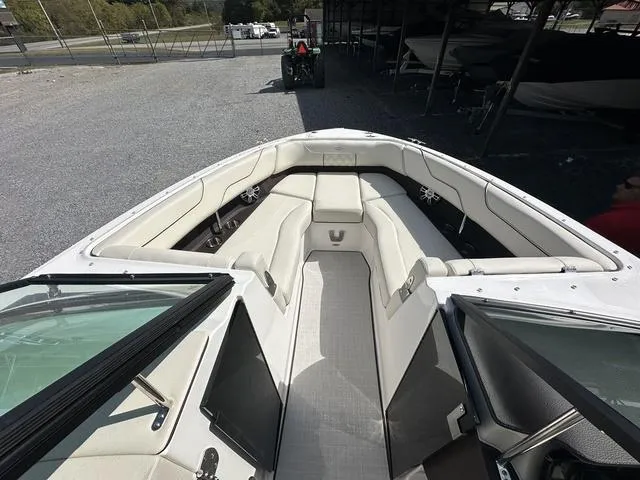 Slide: The Image of 2025 Regal LS6 boat interior with spacious seating and modern design. - 19