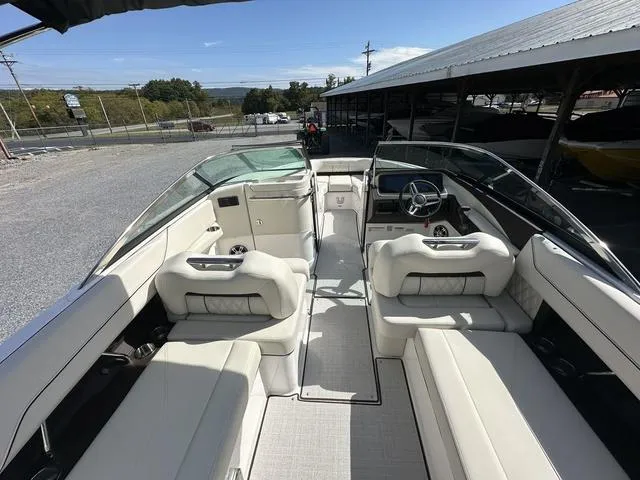 Slide: The Image of 2025 Regal LS6 boat interior with luxurious seating and modern dashboard. - 24