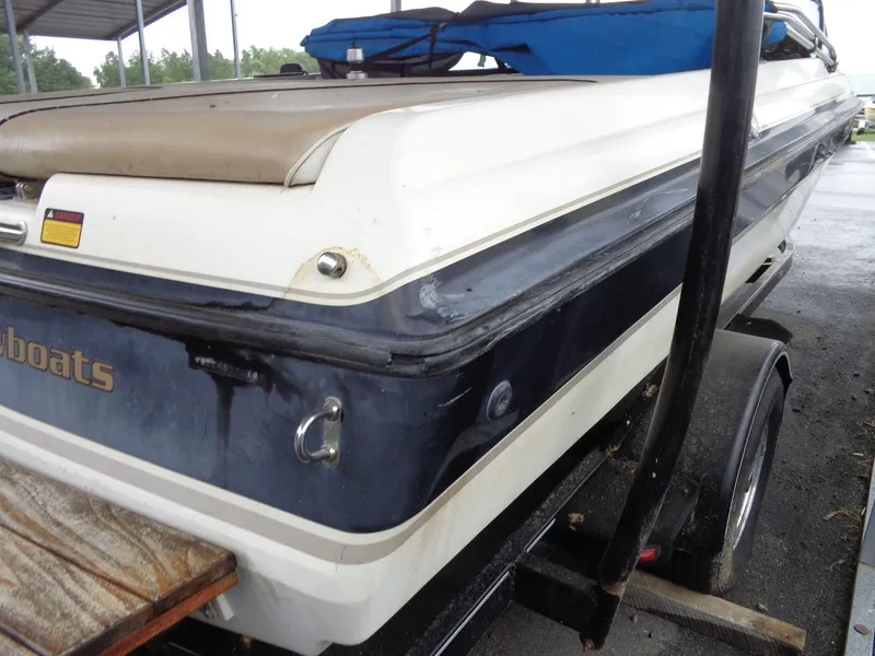 Slide: The Image of 1998 Malibu Sunsetter VLX boat on trailer, rear view, under shelter. - 10