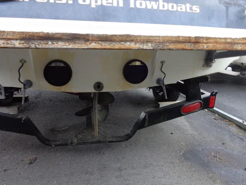 Slide: The Image of Rear view of a 1998 Malibu Sunsetter VLX boat on a trailer. - 15