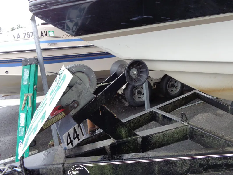 Slide: The Image of 1998 Malibu Sunsetter VLX boat on trailer, close-up of winch and ladder. - 20