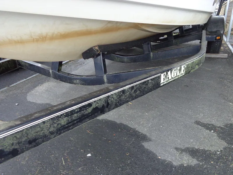 Slide: The Image of 1998 Malibu Sunsetter VLX on Eagle trailer with visible wear and dirt. - 21